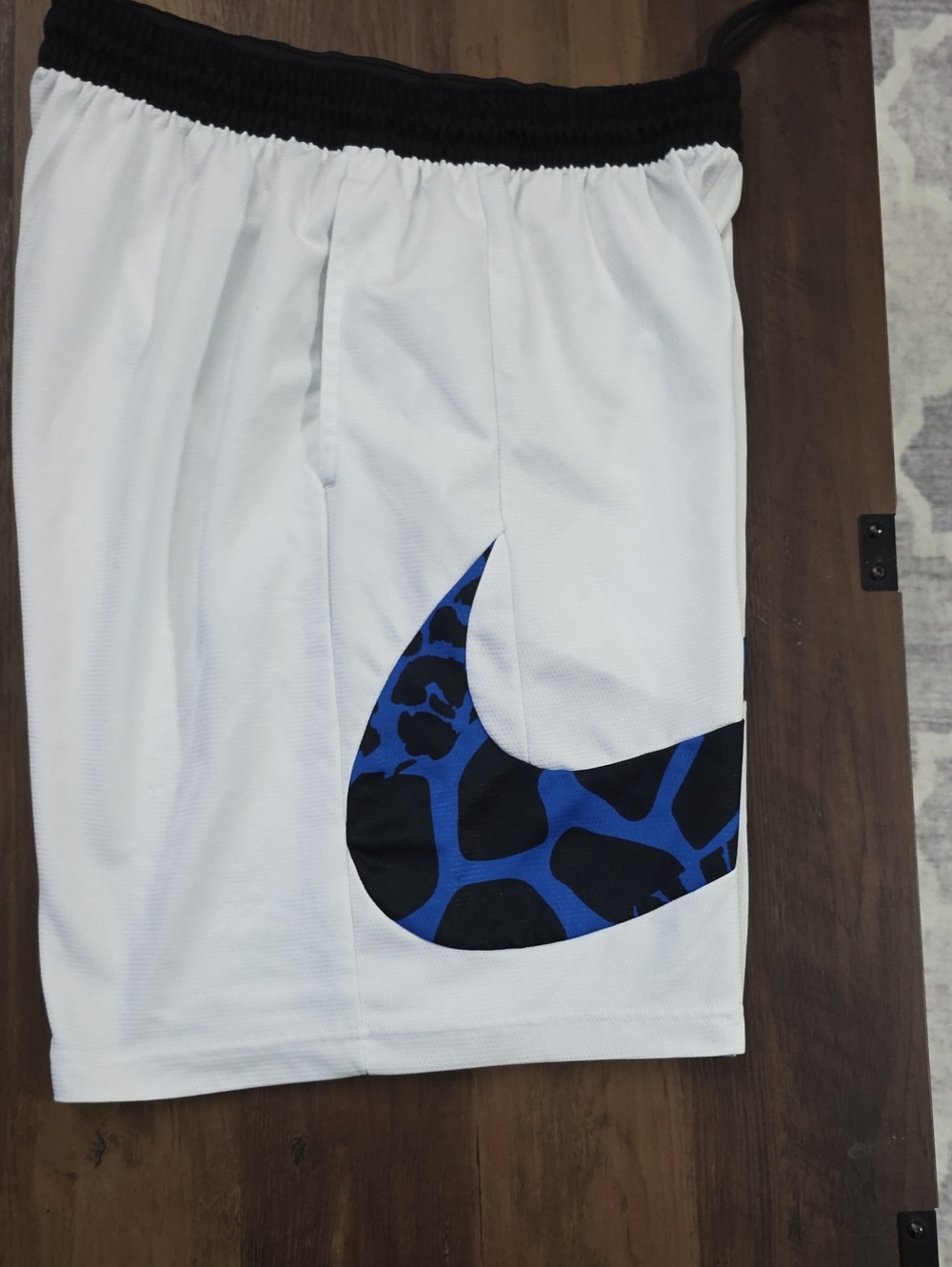 Nike Mens White Athletic Shorts with Blue and Black Swoosh
